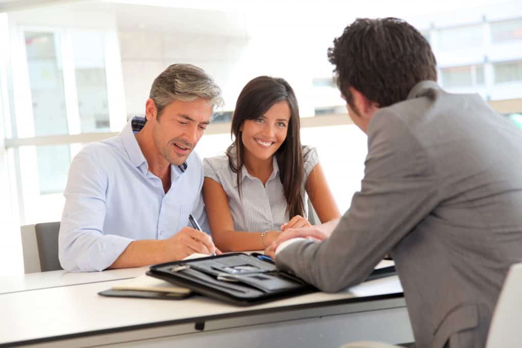 husband wife signing loan mortgage